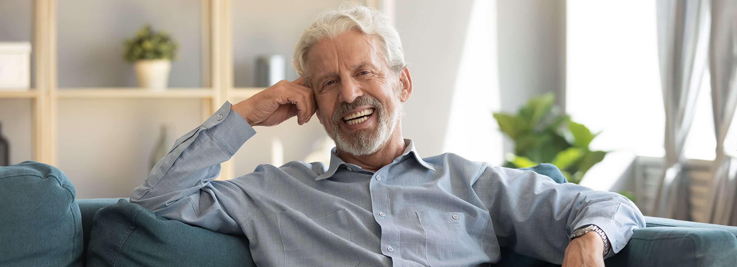 Man smiling after dental repairs in Mount Pleasant, WI