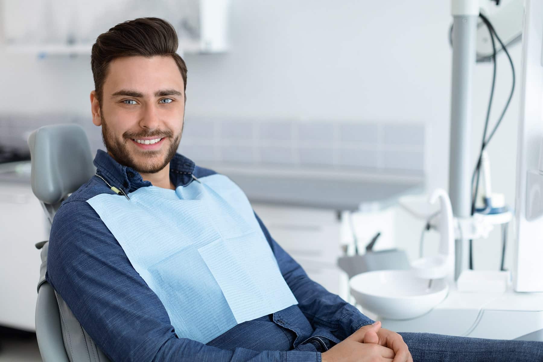 Man smiling after a dental restoration in Mount Pleasant, WI