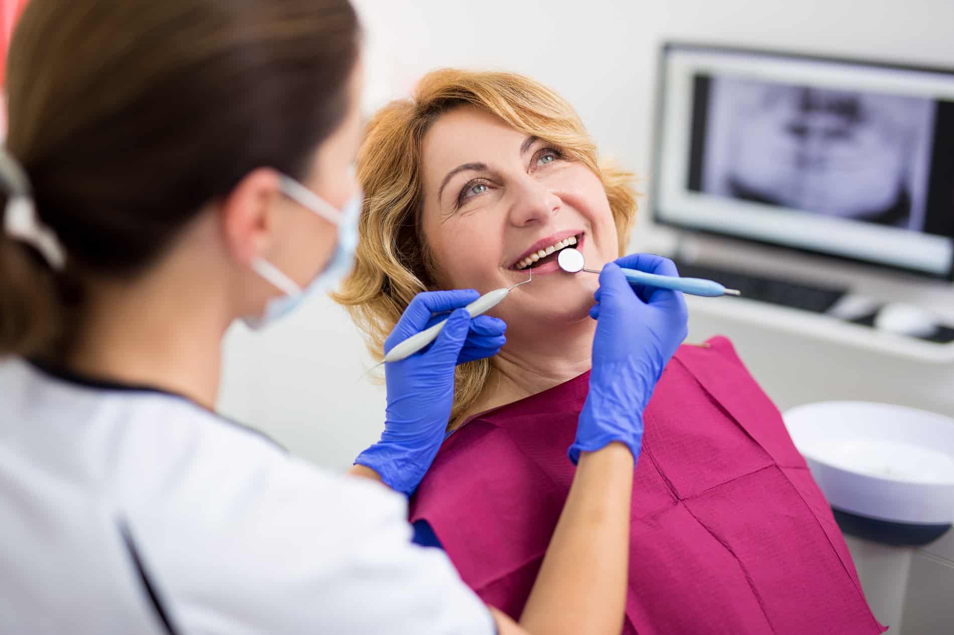 Woman at her all on 4 implant appointment in Mt Pleasant WI