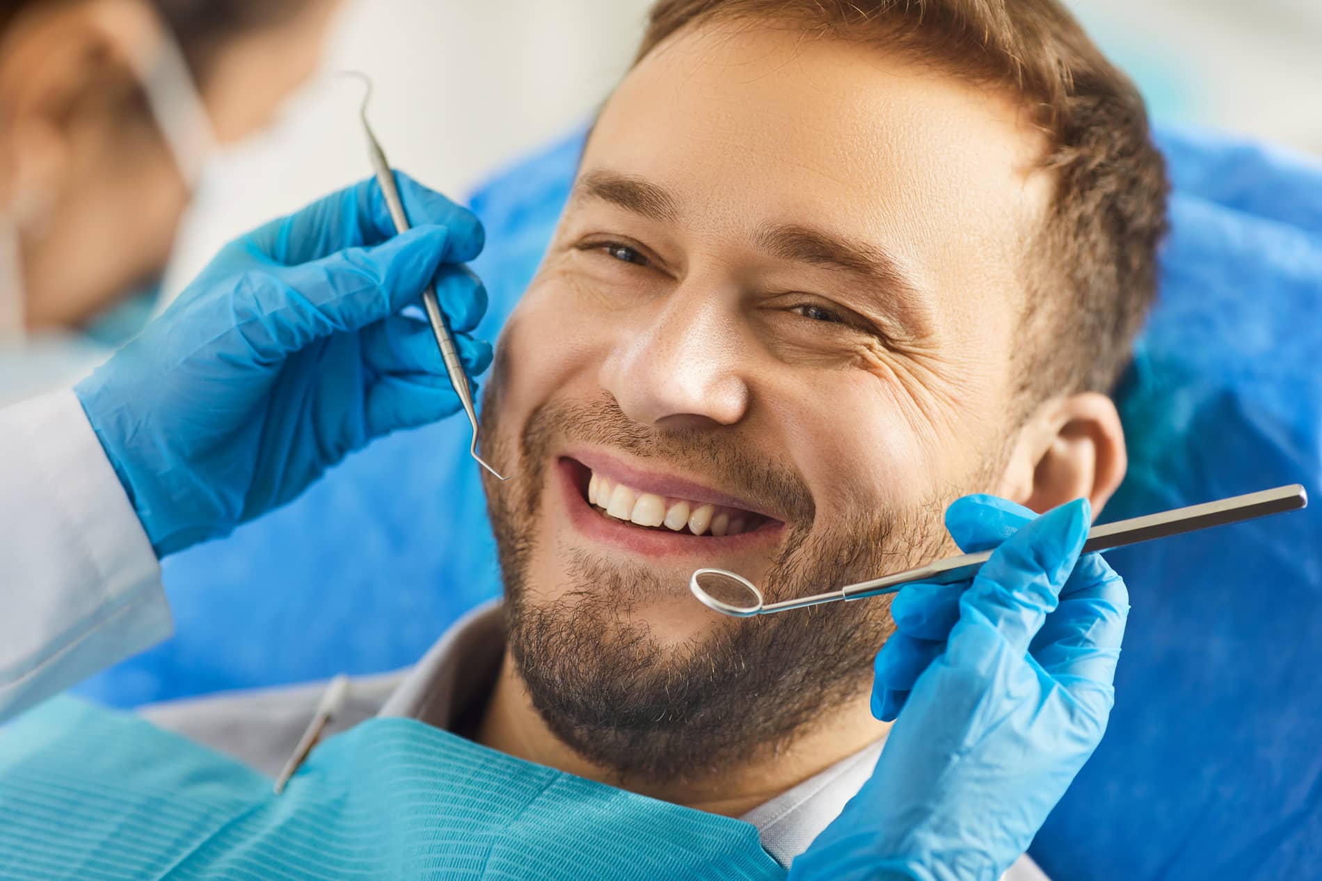 patient satisfied with his single tooth implant treatment at oxford dental in mount pleasant wi