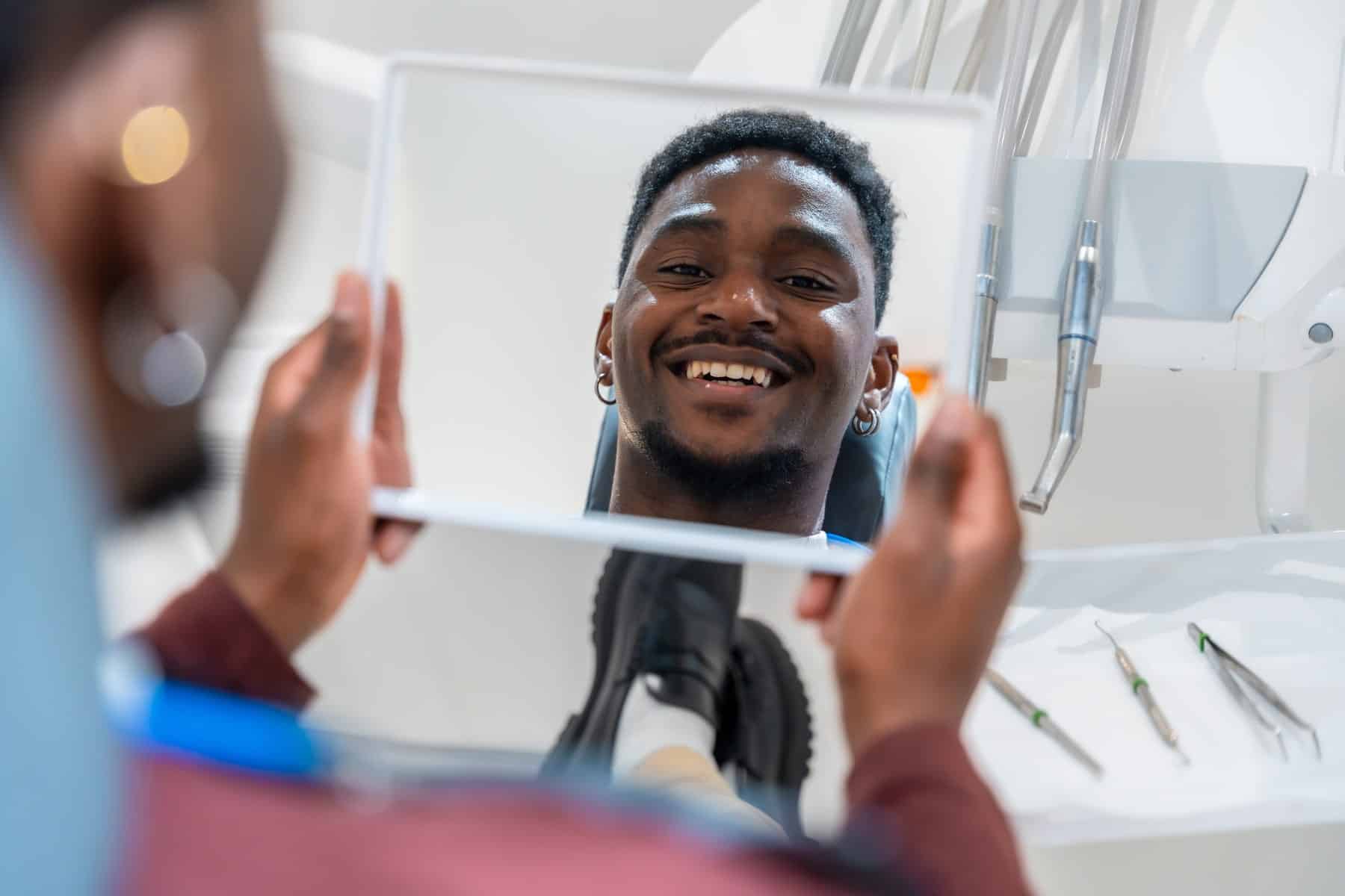 patient satisfied with his teeth whitening service at oxford dental in mount pleasant wi