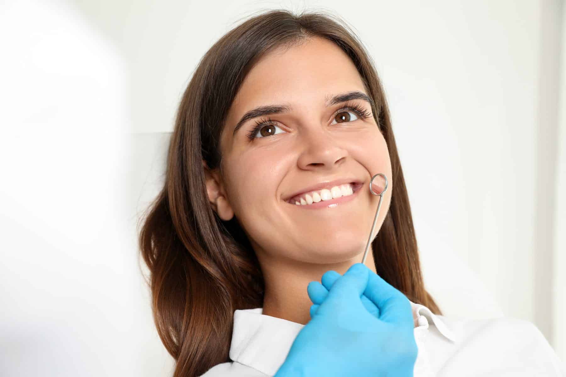 patients enjoying her smile makeover treatment at Oxford Dental in Mount Pleasant WI