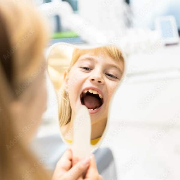 Father and Daughter Brushing Their Teeth